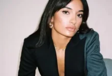 amina 542x420 1 390x220 1